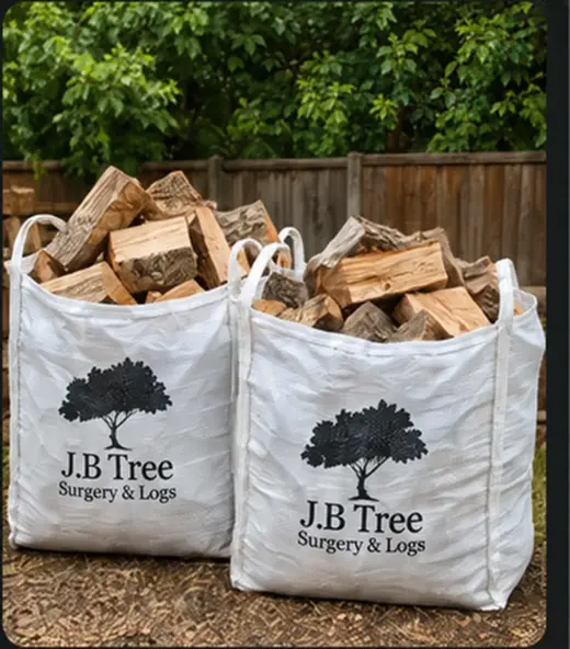 Two large bulk bags filled with hardwood logs